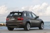 2013 BMW X5 xDrive50i in Sparkling Bronze Metallic from a rear right view